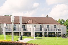 View of the lakeside of the Magnolia Building, including the patio space above the restaurant.
