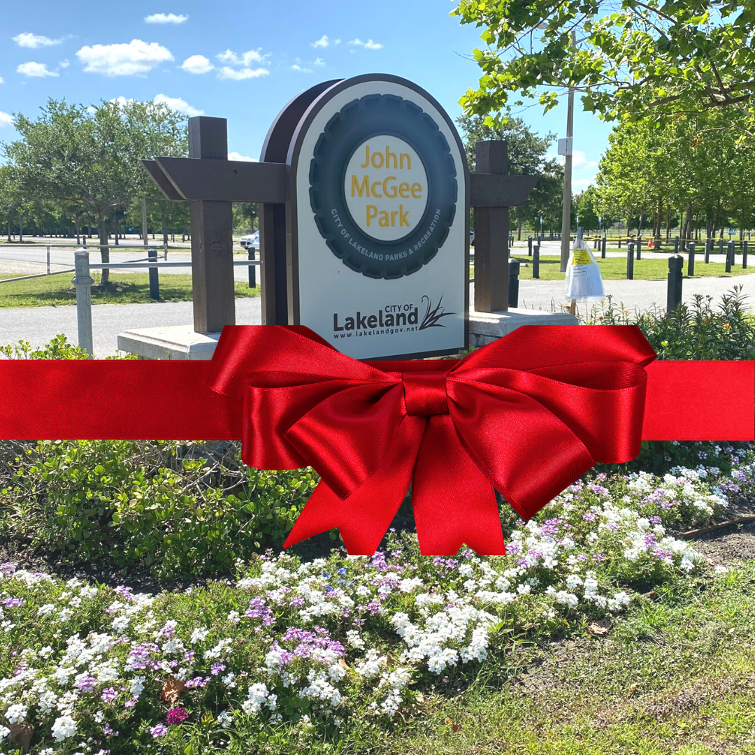 John McGee Park sign with ribbon graphic