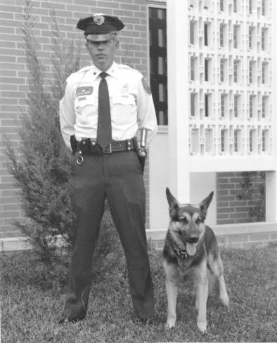 A photo of Officer Ron Bowling Sr. and K9 Sarge