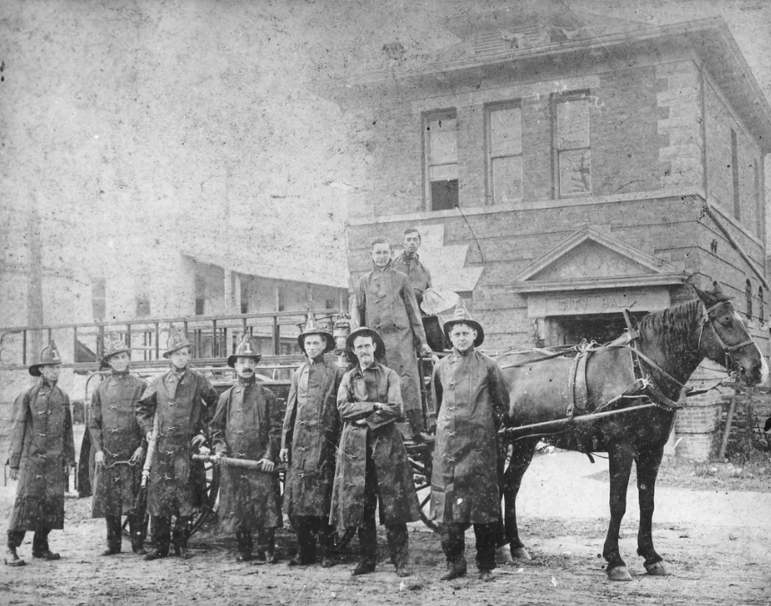 1913 Members of the Volunteer Company No. 1 of the Lakeland Fire Department crew pose with their horse-drawn fire wagon in front of City Hall in Lakeland, Florida; link to Look for the Helpers Flickr album