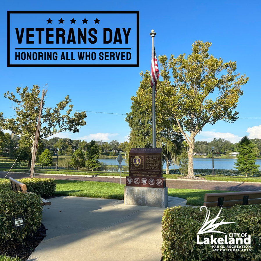 Photo of the Purple heart memorial at Veterans Park with the text: Veterans Day, Honoring All Who Served