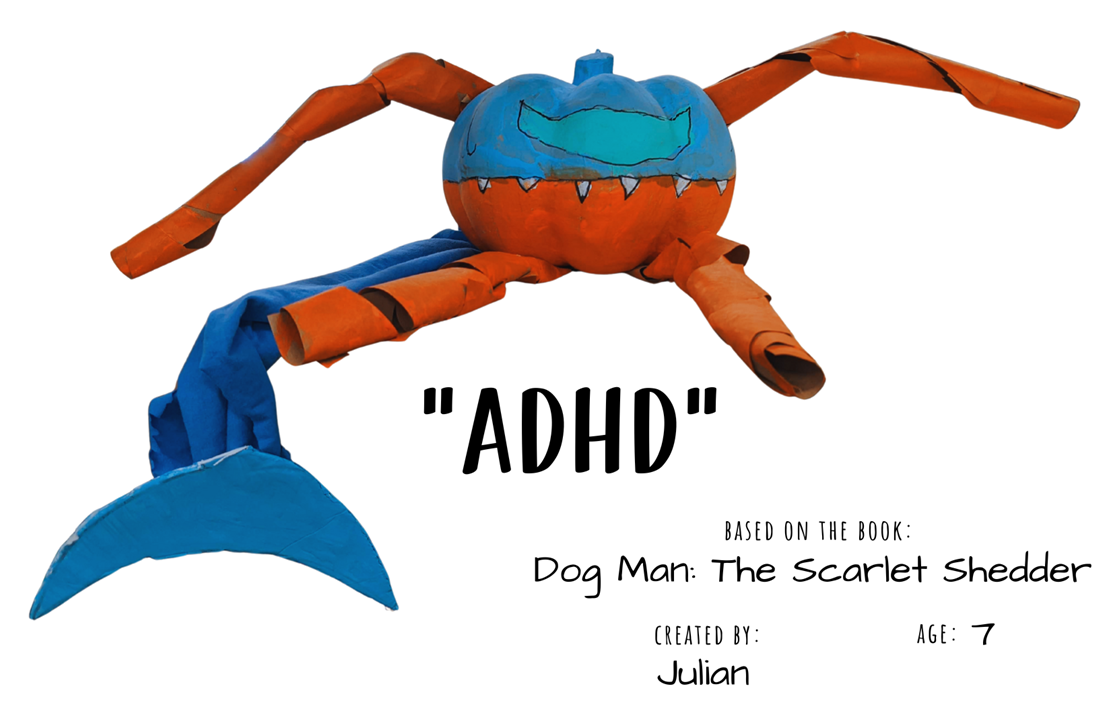 Craft pumpkin painted orange and blue like a robot with text "ADHD; Based on the book Dog Man: The Scarlett Shedder; Created by: Julian, Age 7"