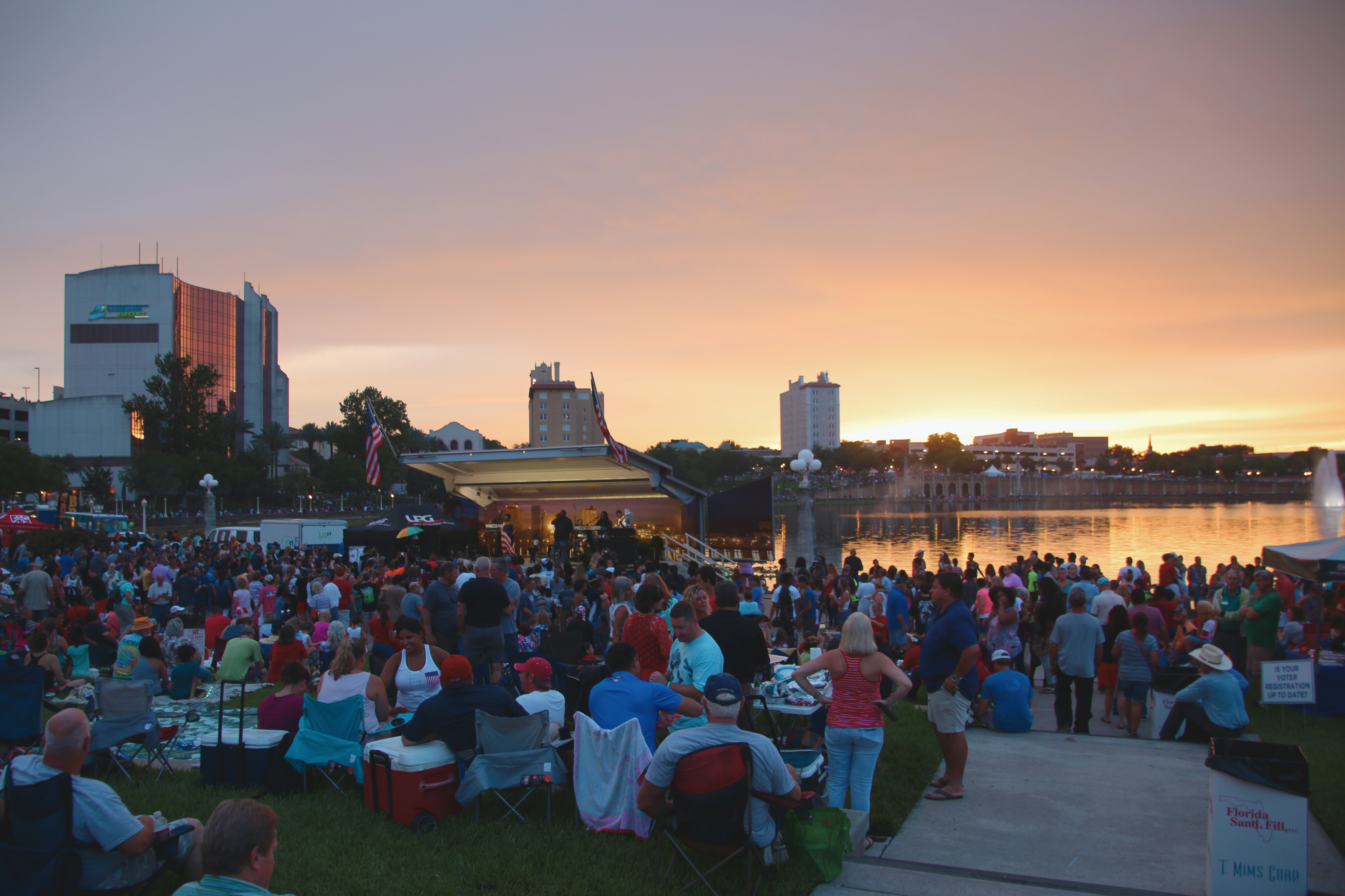 Large crowd on the Lake Mirror amphitheater overlooking the Lake and a stage