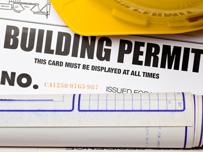 An image of a building permit that reads "This card must be displayed at all times."