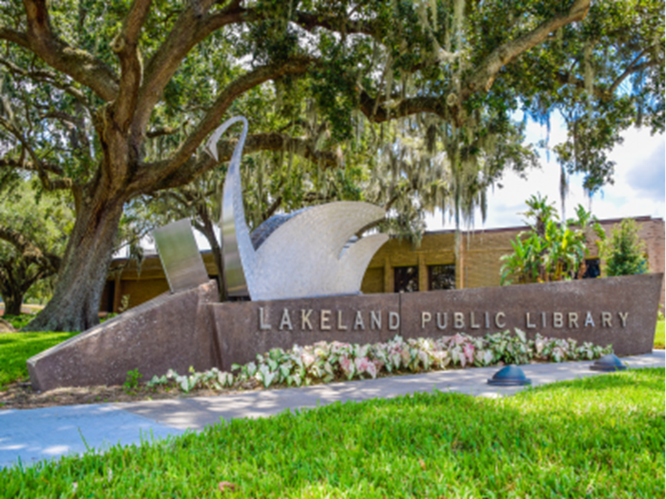Lakeland Public Library swan sign on front lawn