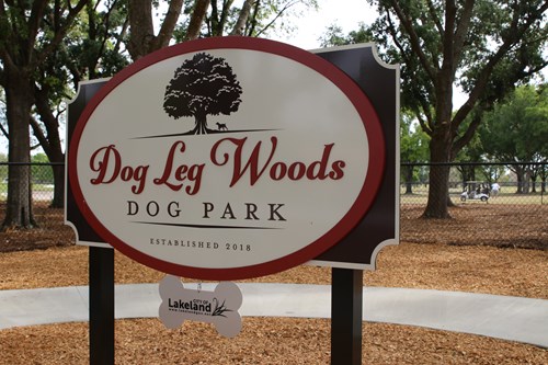 Photo of the Dog Leg Woods sign at the dog park